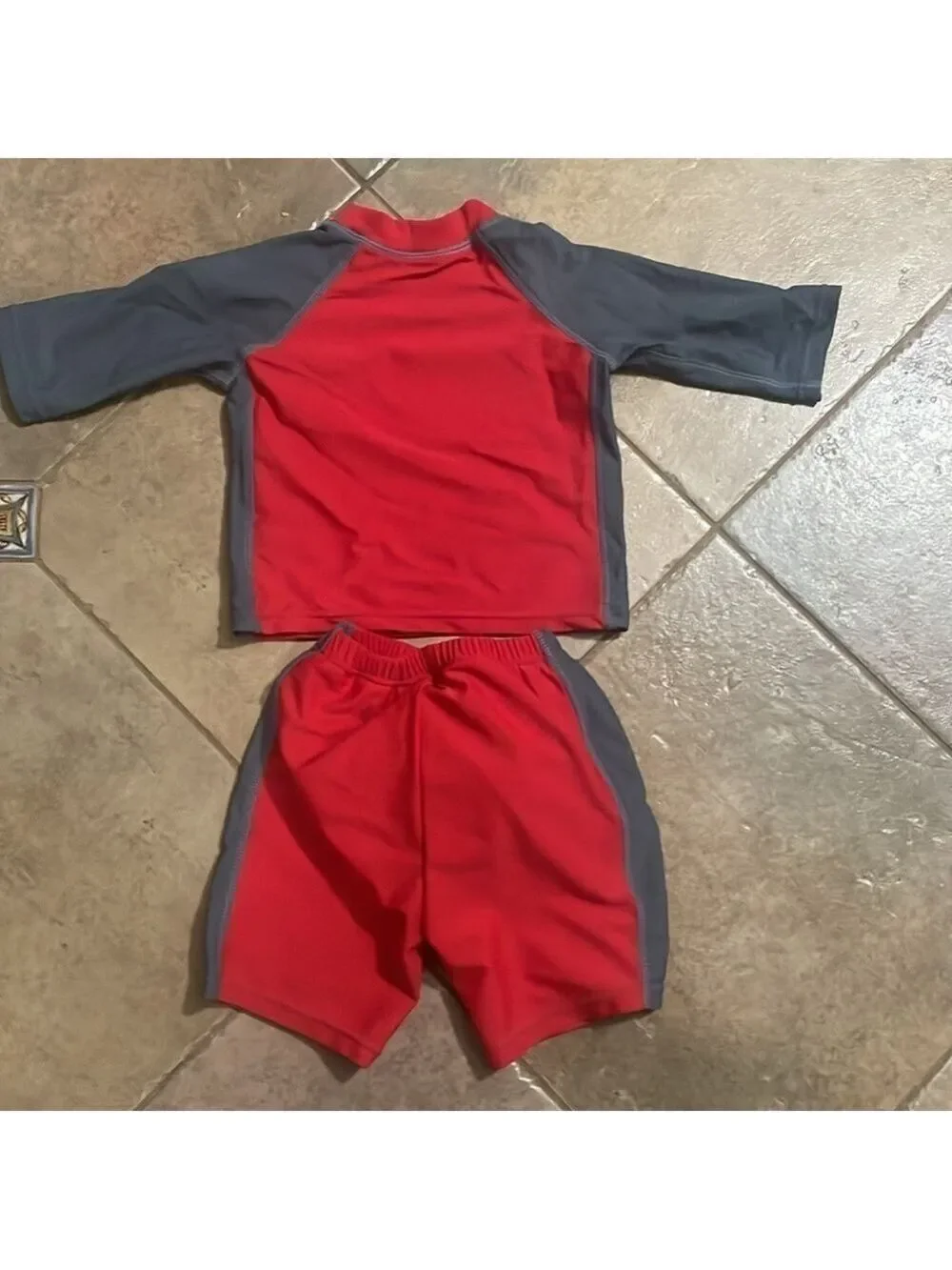 I play boys shark swim shirts and shirt size 12 months